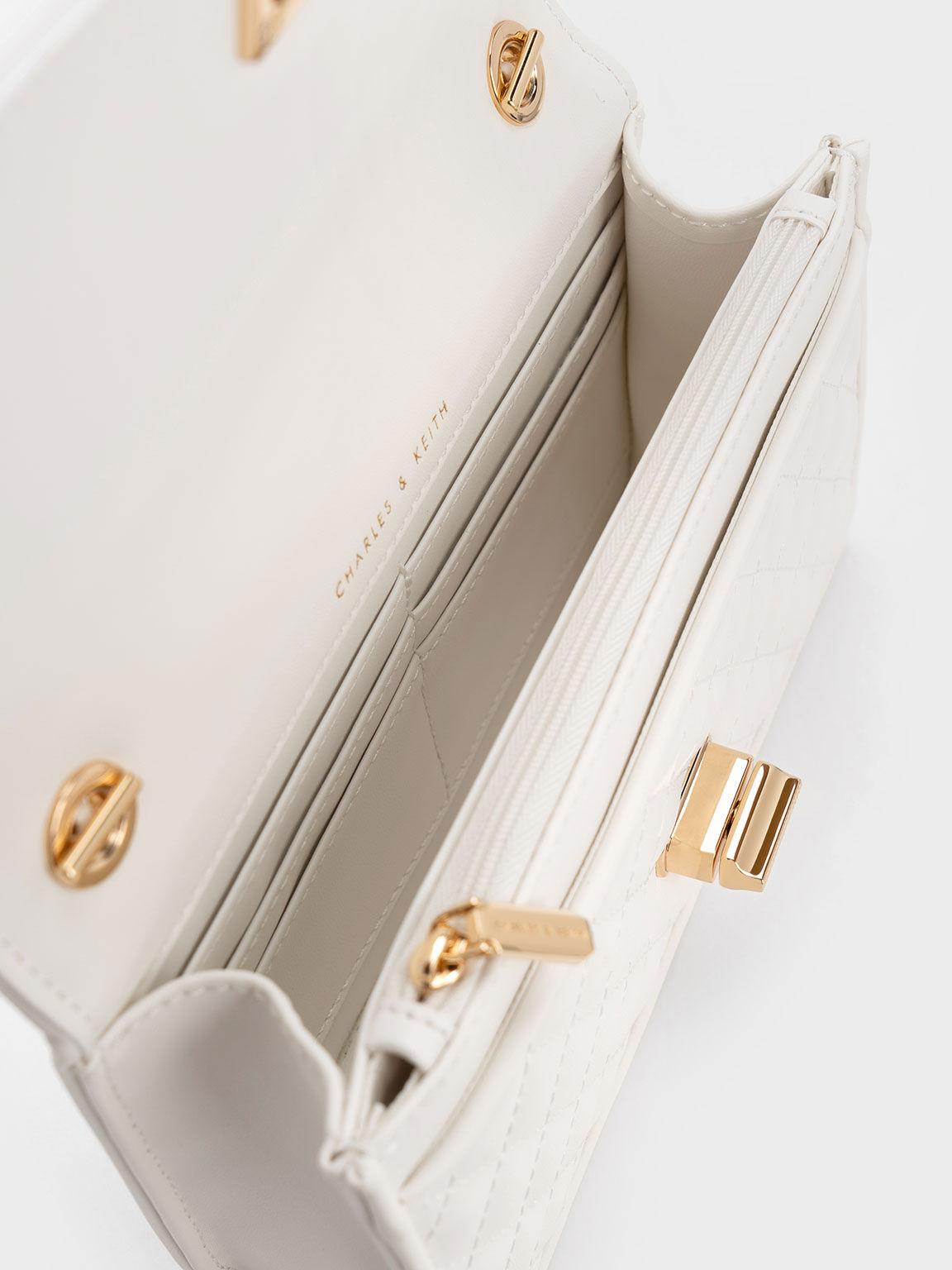 Túi Charles Keith Clutch Chần Bông Metallic Turn-Lock Quilted Trắng