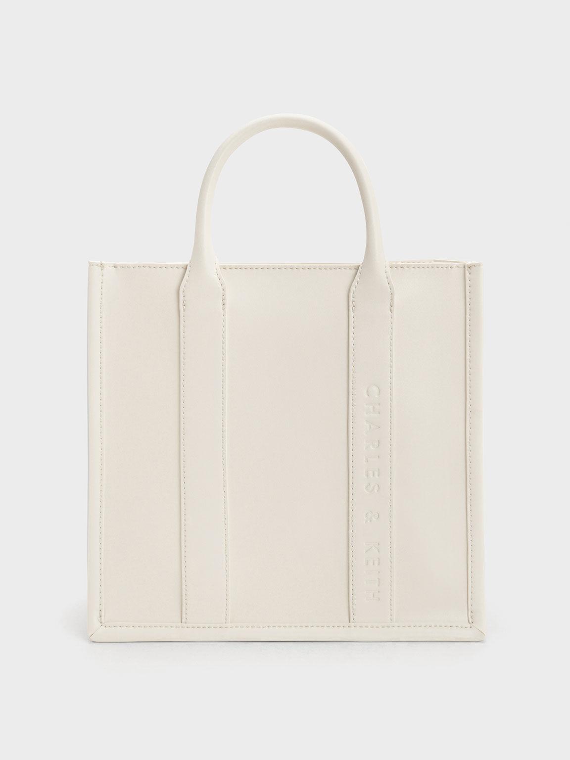 Túi Charles Keith Tote Phom Vuông Clover Trapeze Kem