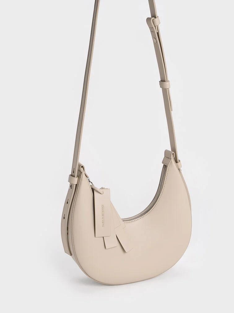 Túi Charles & Keith Hobo Cockade Crescent Nữ Nâu Sữa