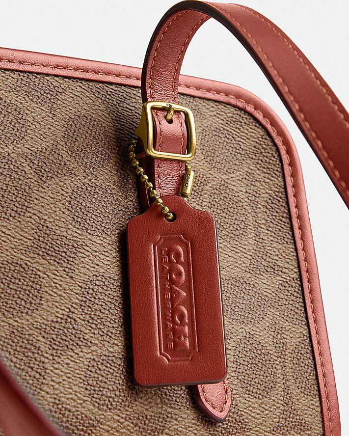 Túi Coach Swing Zip In Signature Canvas Nữ Nâu